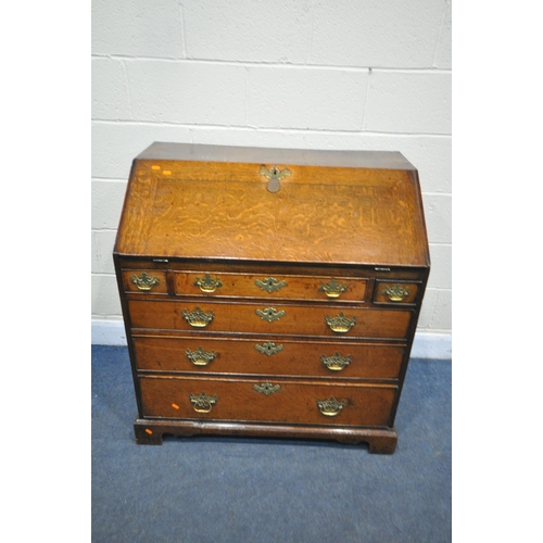 1341 - A GEORGIAN OAK BUREAU, with a fitted interior over six exterior drawers on bracket feet, width 95cm ... 