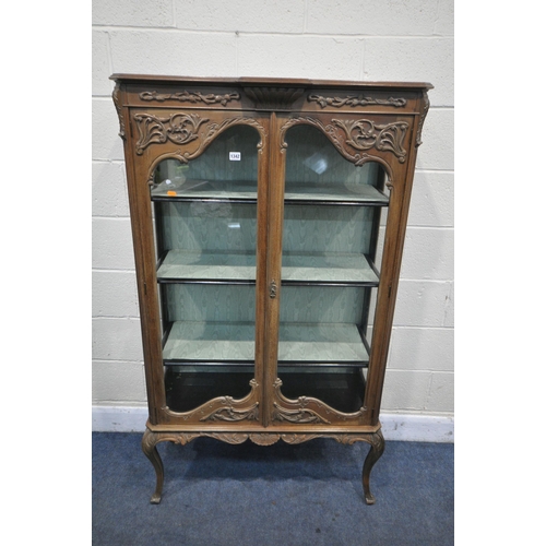 1342 - AN EARLY TO MID CENTURY FRENCH WALNUT TWO DOOR DISPLAY CABINET, enclosing three shelves on cabriole ... 