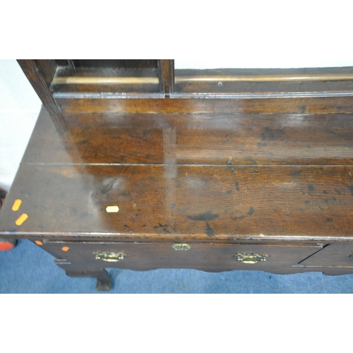 1350 - A GEORGIAN OAK DRESSER, a plate rack with an arrangement of shelving over a base with three deep dra... 