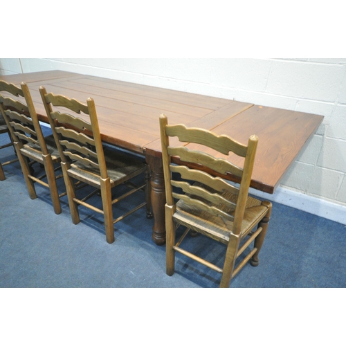 1360 - A GEORGIAN STYLE OAK REFRECTORY TABLE, on turned legs with additional leaves at each end, extended l... 