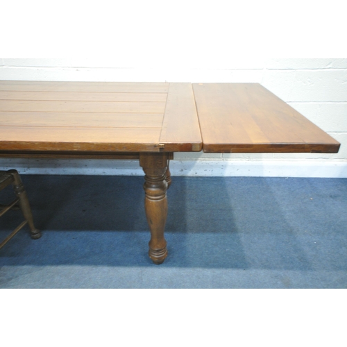 1360 - A GEORGIAN STYLE OAK REFRECTORY TABLE, on turned legs with additional leaves at each end, extended l... 