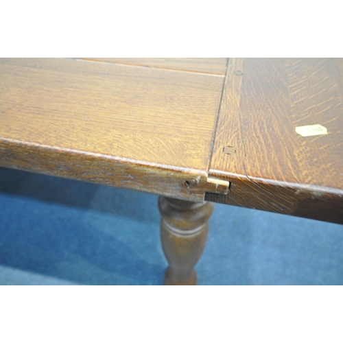 1360 - A GEORGIAN STYLE OAK REFRECTORY TABLE, on turned legs with additional leaves at each end, extended l... 