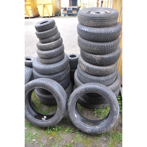 1001 - A SELECTION OF PART WORN TYRES of different sizes some still on steel rims (approx. 27 tires)