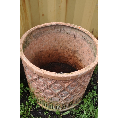 1004 - A SELECTION OF WEATHERED TERRACOTTA POTS comprising three circular terracotta pots and a smaller pla... 