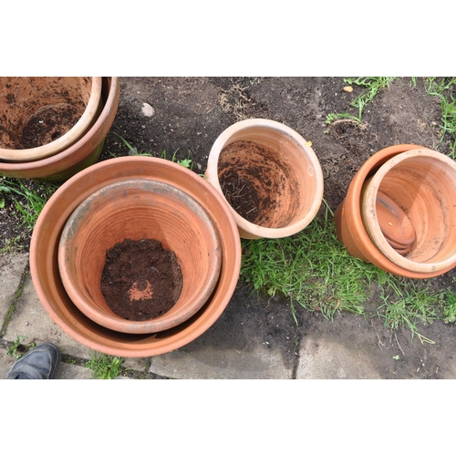 1005 - A COLLECTION OF TEN WEATHERED TERRACOTTA POTS of all different sizes largest pot diameter 43cm (10)