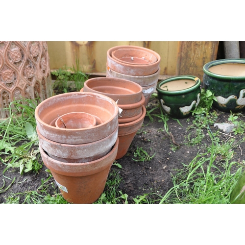 1006 - A COLLECTION OF GLAZED POTS comprising four glazed pots of graduating sizes with image of ducks/gees... 