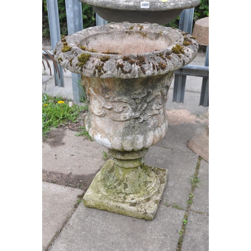 1009 - A WEATHERED COMPOSITE COMPAGNA GARDEN URN measuring diameter 44cm x height 63cm, along with a concre... 