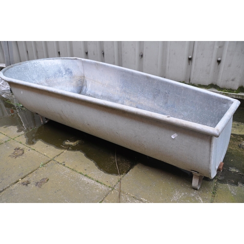 1011 - A VINTAGE GALVANISED STEEL SLIPPER BATH measuring width 166cm x depth 71cm x height 43cm