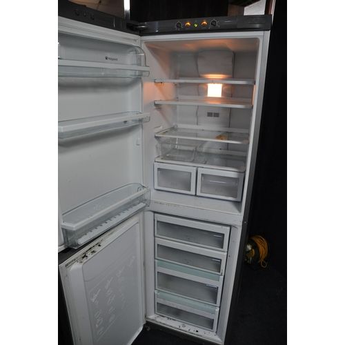 1059 - A HOTPOINT FF187E FRIDGE FREEZER measuring 60cm x depth 64cm x height 187cm (PAT pass and working)