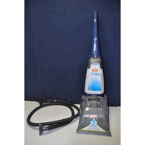 1084 - A VAX V-028 CARPET CLEANER with hose and single attachment (PAT pass and powering up)