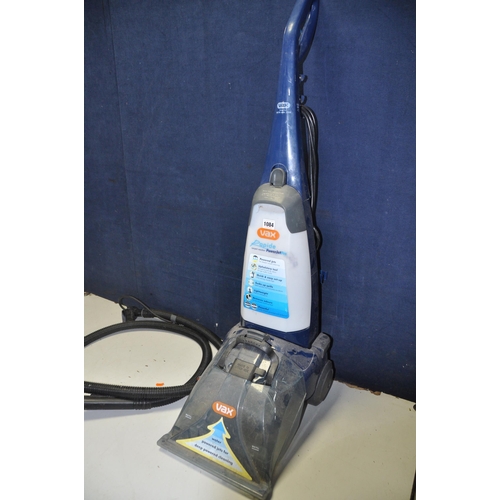 1084 - A VAX V-028 CARPET CLEANER with hose and single attachment (PAT pass and powering up)