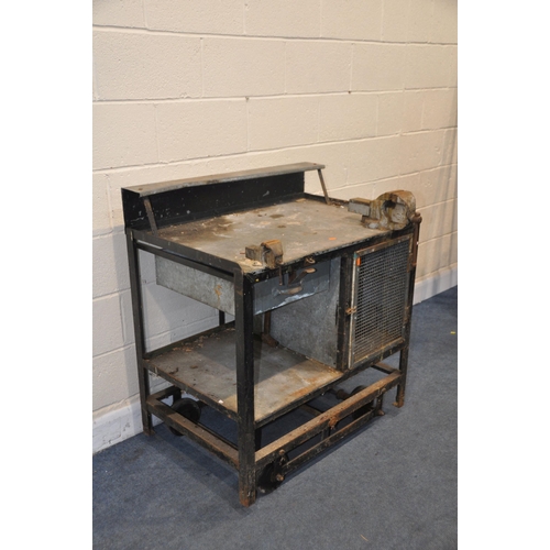 1090 - A METAL WORKBENCH on a wheeled base, lever to the rear with lifting mechanism, two vices, a Woden an... 