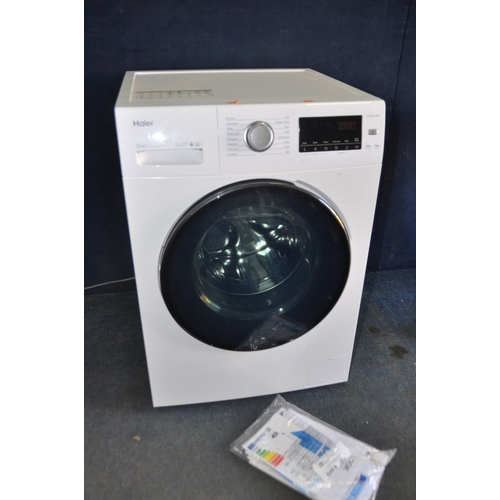 1092 - A HAIER HW100B1439N WASHING MACHINE measuring width 60cm x depth 69cm x height 85cm (PAT pass and po... 