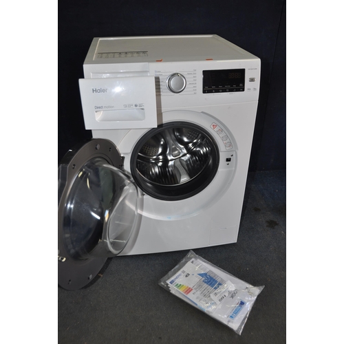 1092 - A HAIER HW100B1439N WASHING MACHINE measuring width 60cm x depth 69cm x height 85cm (PAT pass and po... 