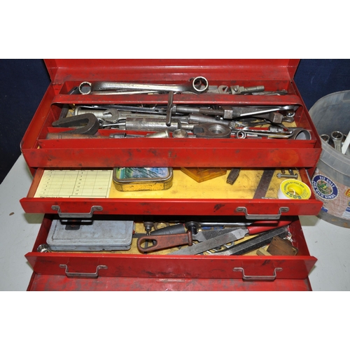 1112 - A METAL BEACH TOOLBOX with hinged top and fall front enclosing three drawers containing a small quan... 