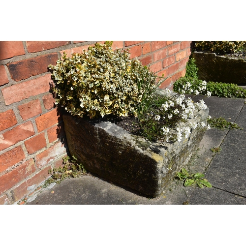 957 - A VINTAGE SANDSTONE PUMP TROUGH width 54cm depth 57cm height 30cm at highest point with soil and pla... 