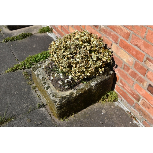 958 - A VINTAGE SANDSTONE PUMP TROUGH width 54cm depth 57cm height 30cm at highest point with soil and pla... 