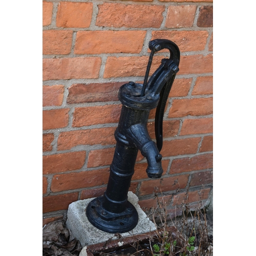 972 - A VINTAGE TREACLE GLAZED TROUGH with one curved end depth 57cm, a vintage water pump and a stone blo... 