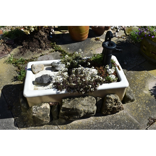 973 - A VINTAGE ENAMEL SINK WITH DRAINER width 92cm depth 45cm height 24cm along with a series of sandston... 