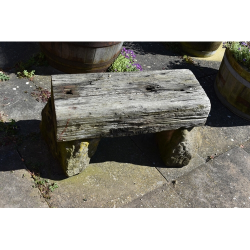 977 - A VINTAGE SANDSTONE BLOCK AND RAILWAY TIE BENCH width 72cm depth 40cm height 40cm( this lot is not s... 