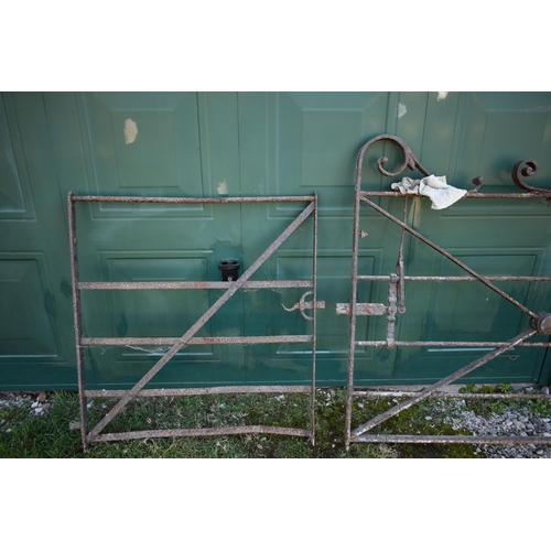 989 - A SET OF LARGE VINTAGE GATES including a 310cm wide gate with scrolled pedaments, x braced with latc... 