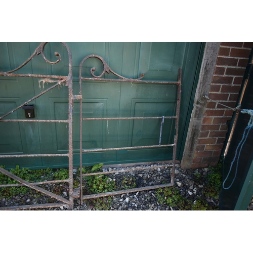 989 - A SET OF LARGE VINTAGE GATES including a 310cm wide gate with scrolled pedaments, x braced with latc... 