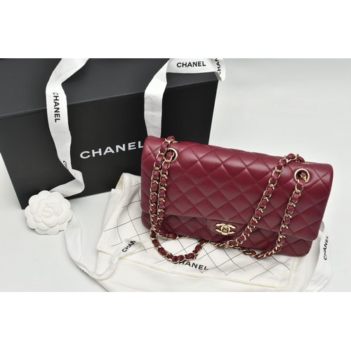 1 - A CHANEL CLASSIC MEDIUM DOUBLE FLAP HANDBAG, with signature diamond quilted lambskin leather exterio... 