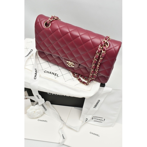 1 - A CHANEL CLASSIC MEDIUM DOUBLE FLAP HANDBAG, with signature diamond quilted lambskin leather exterio... 