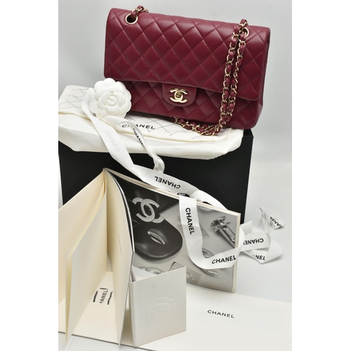 1 - A CHANEL CLASSIC MEDIUM DOUBLE FLAP HANDBAG, with signature diamond quilted lambskin leather exterio... 