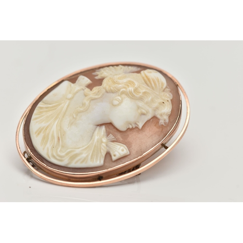 108 - A CAMEO BROOCH, oval carved shell cameo depicting a lady in profile, collet set in a rose metal moun... 