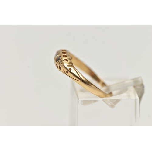 113 - AN EARLY 20TH CENTURY 18CT GOLD BOAT RING, set with three small diamonds interspaced with two circul... 