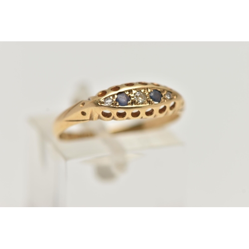 113 - AN EARLY 20TH CENTURY 18CT GOLD BOAT RING, set with three small diamonds interspaced with two circul... 