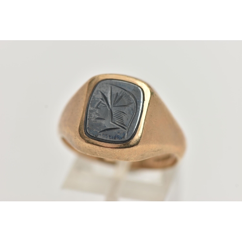 12 - A 9CT GOLD AND HEMATITE GENTS SIGNET RING, yellow gold rectangular signet, inlay set with a hematite... 