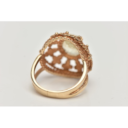 122 - A 9CT GOLD GEM SET RING, set with an oval cut pale green stone assessed as spinel, in a four claw se... 