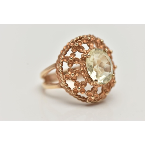 122 - A 9CT GOLD GEM SET RING, set with an oval cut pale green stone assessed as spinel, in a four claw se... 