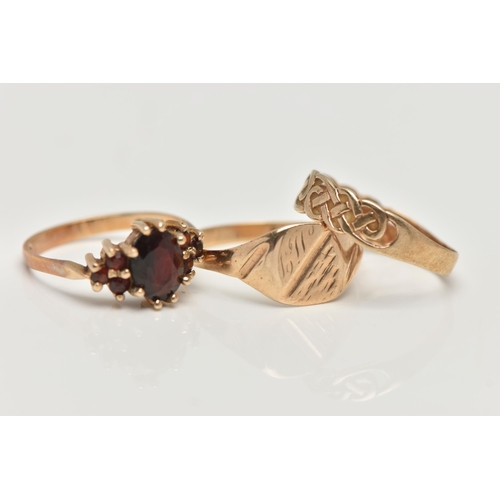 180 - THREE 9CT GOLD RINGS, the first a garnet cluster, hallmarked 9ct London, ring size M, second a squar... 