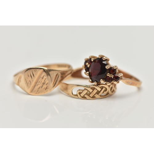 180 - THREE 9CT GOLD RINGS, the first a garnet cluster, hallmarked 9ct London, ring size M, second a squar... 