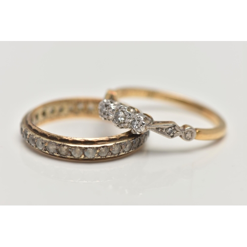 181 - TWO YELLOW METAL RINGS, the first a three stone diamond ring, set with a central round brilliant cut... 