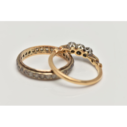 181 - TWO YELLOW METAL RINGS, the first a three stone diamond ring, set with a central round brilliant cut... 