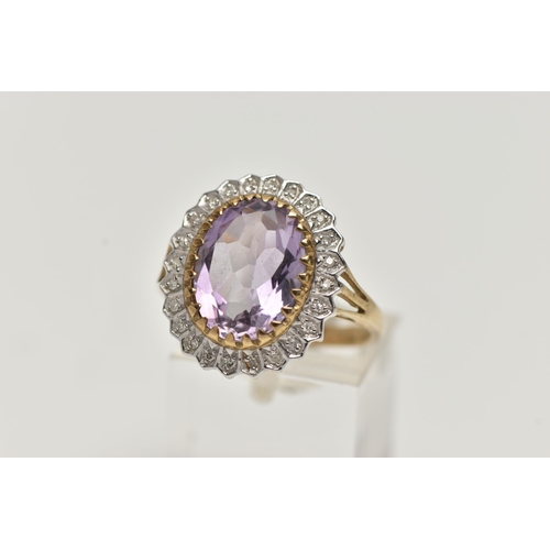 2 - A 9CT GOLD AMETHYST AND DIAMOND DRESS RING, a principal set oval cut amethyst with halo surround of ... 