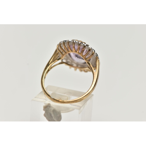 2 - A 9CT GOLD AMETHYST AND DIAMOND DRESS RING, a principal set oval cut amethyst with halo surround of ... 