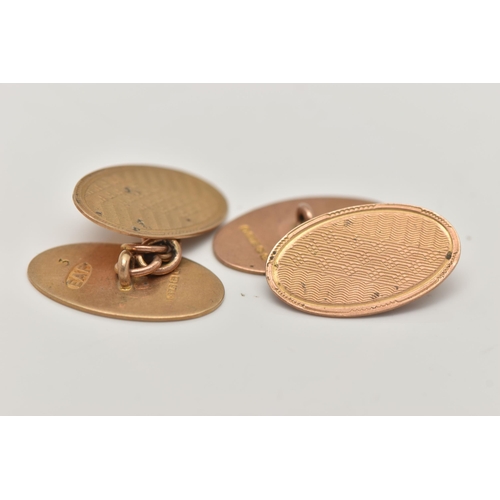 20 - A PAIR OF 9CT GOLD CUFFLINKS, oval cufflinks, engine turned pattern, chain link fittings, hallmarked... 