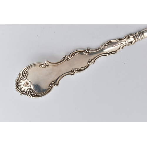 201 - AN AMERICAN STERLING SILVER LADLE, the handle cast with scroll and shell decoration and engraved mon... 