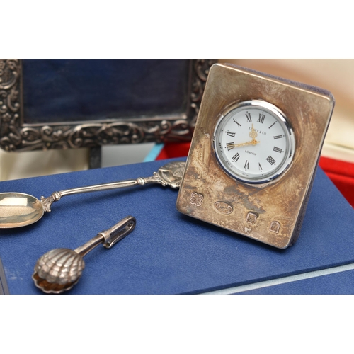 208 - A SMALL PARCEL OF SILVER ITEMS AND EMPTY BOXES, comprising a modern silver mounted bedside clock wit... 