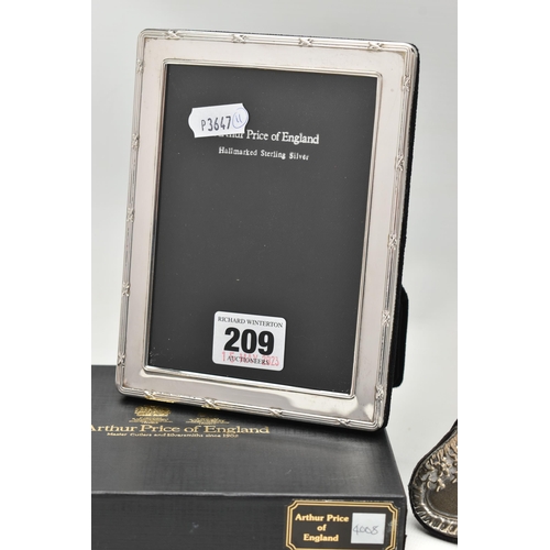 209 - A BOXED ARTHUR PRICE SILVER RECTANGULAR PHOTOGRAPH FRAME AND AN EDWARDIAN STYLE SILVER PHOTOGRAPH FR... 