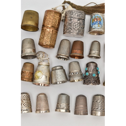 210 - EIGHT SILVER THIMBLES AND A QUANTITY OF ASSORTED METAL THIMBLES, ETC, the silver thimbles include on... 