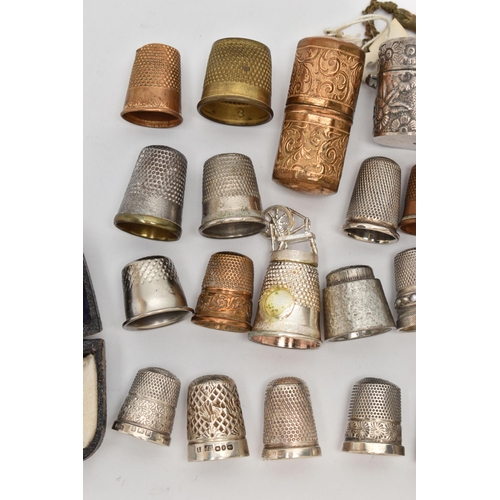 210 - EIGHT SILVER THIMBLES AND A QUANTITY OF ASSORTED METAL THIMBLES, ETC, the silver thimbles include on... 