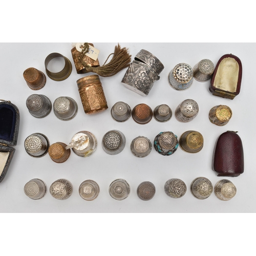 210 - EIGHT SILVER THIMBLES AND A QUANTITY OF ASSORTED METAL THIMBLES, ETC, the silver thimbles include on... 