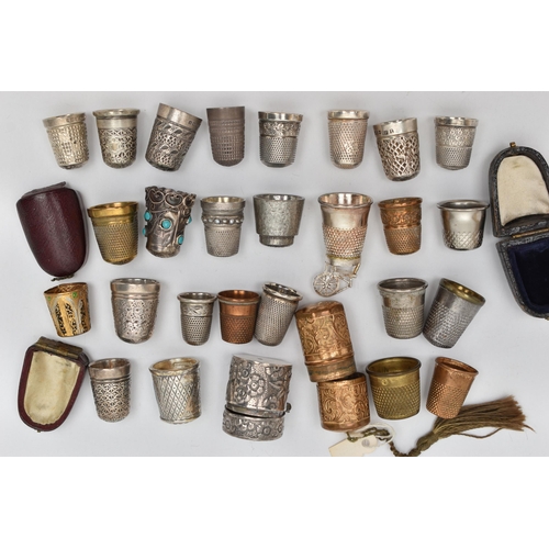 210 - EIGHT SILVER THIMBLES AND A QUANTITY OF ASSORTED METAL THIMBLES, ETC, the silver thimbles include on... 