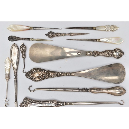 217 - TWELVE SILVER HANDLED BUTTON HOOKS AND SHOE HORNS, together with six mother of pearl handled needlew... 